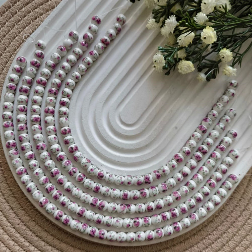 مهره سرامیکی گرد گلدار(فروش بصورت ریسه ای)